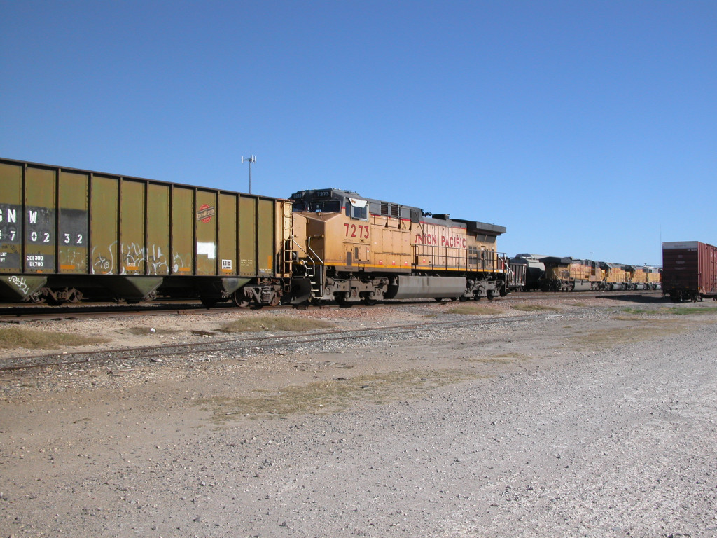 UP 7273  20Dec2012  Tied-down with a string of hopper cars 